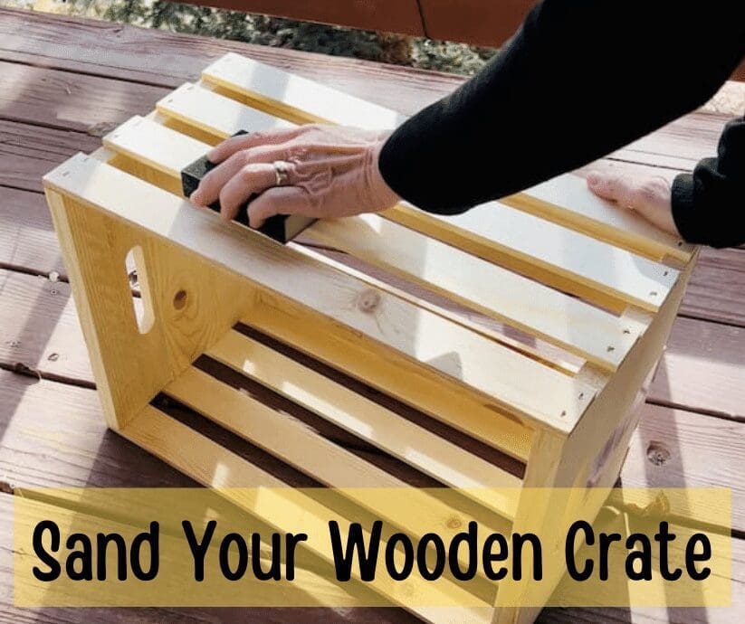 sanding-wooden-crate-outdoors