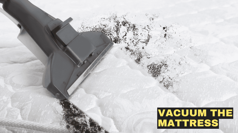 vacuuming-the-babys-white-crib-mattress